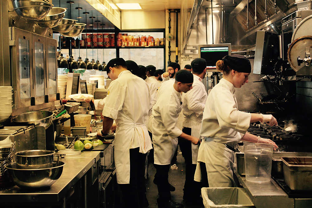 Illustration of concurrency using a chef juggling multiple cooking tasks